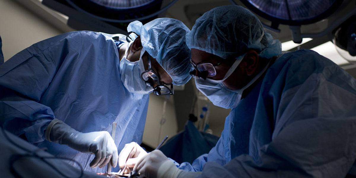 Surgeons performing surgery on a patient