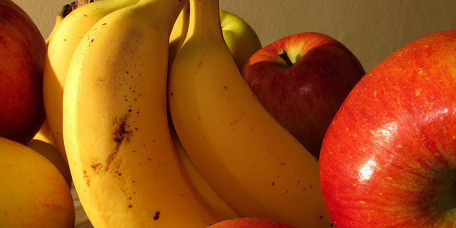 Close Up Image of Bananas and Apples