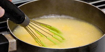 Photo of a Pot with Some Liquid